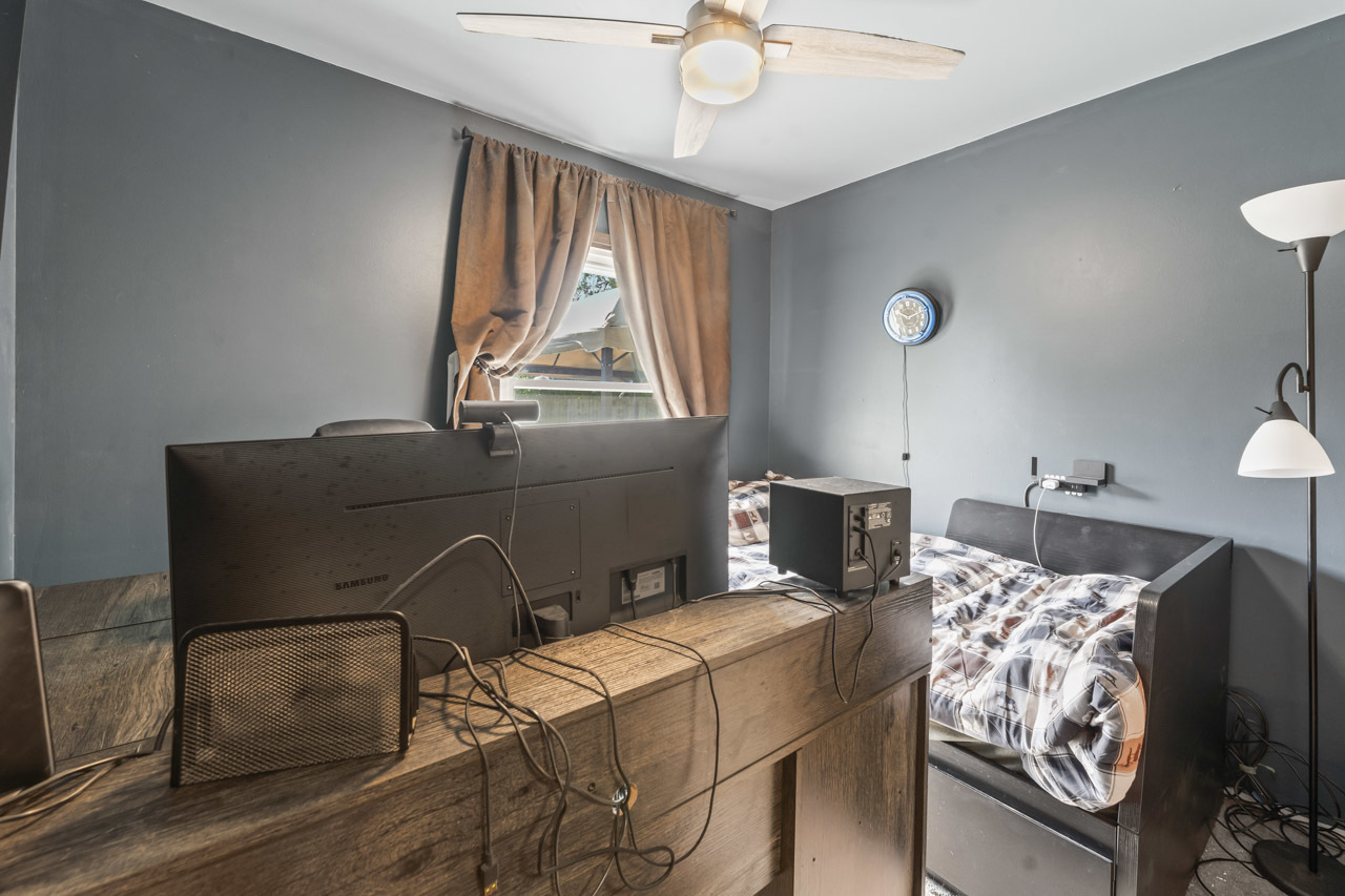 34 Spring Valley Lane Streamwood, IL 60107 - Photo 12 of 24 a bedroom with furniture and a window