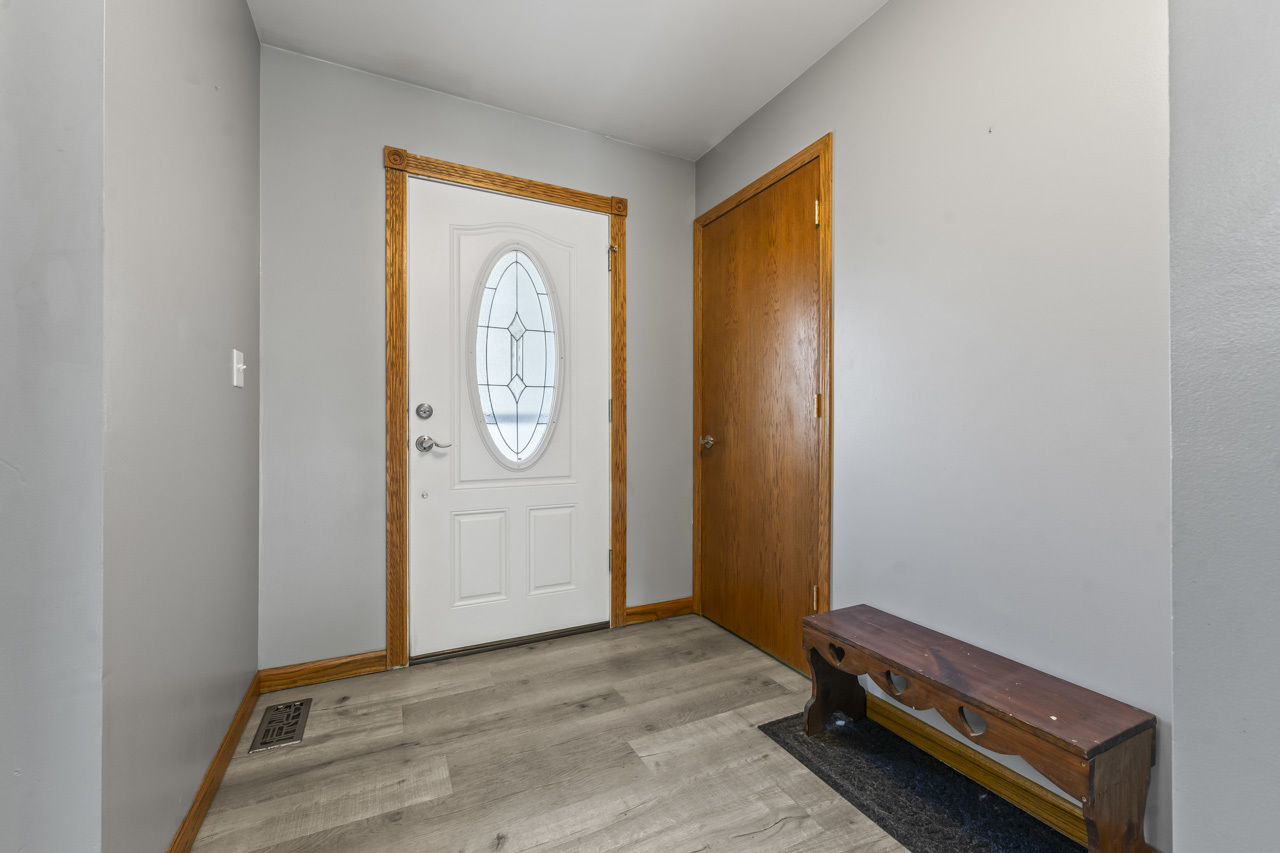 34 Spring Valley Lane Streamwood, IL 60107 - Photo 14 of 24 a view of front door with wooden floor