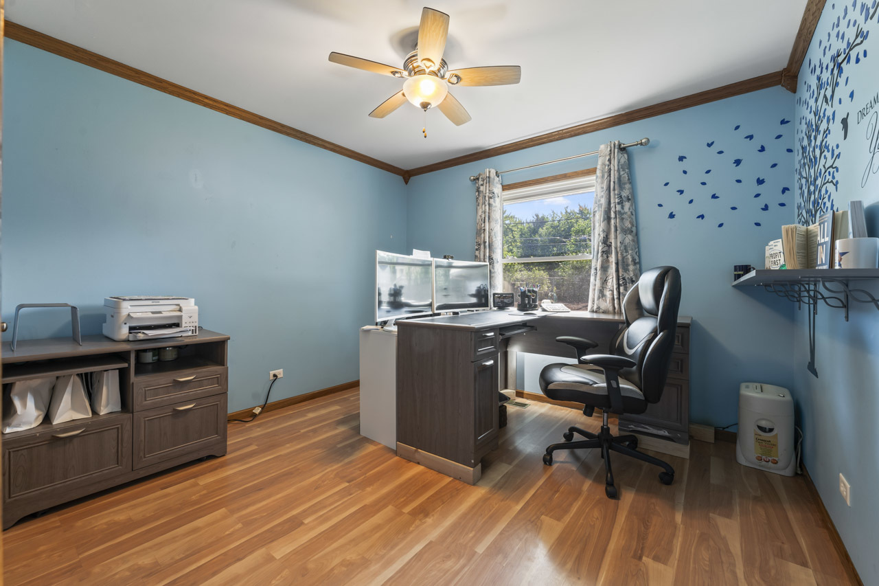 34 Spring Valley Lane Streamwood, IL 60107 - Photo 15 of 24 a view of a workspace with furniture and a window