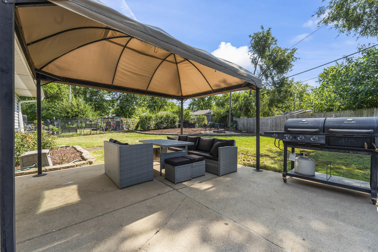 34 Spring Valley Lane Streamwood, IL 60107 - Photo 19 of 24 a view of backyard with swimming pool and outdoor seating