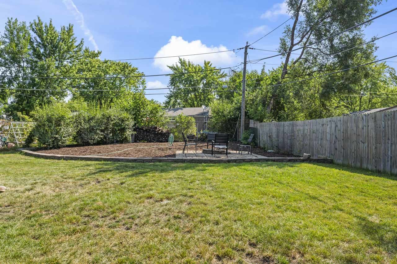 34 Spring Valley Lane Streamwood, IL 60107 - Photo 20 of 24 a view of a swimming pool with a patio