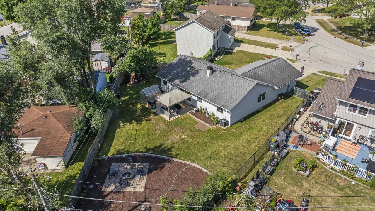 34 Spring Valley Lane Streamwood, IL 60107 - Photo 23 of 24 an aerial view of a house with a garden and trees