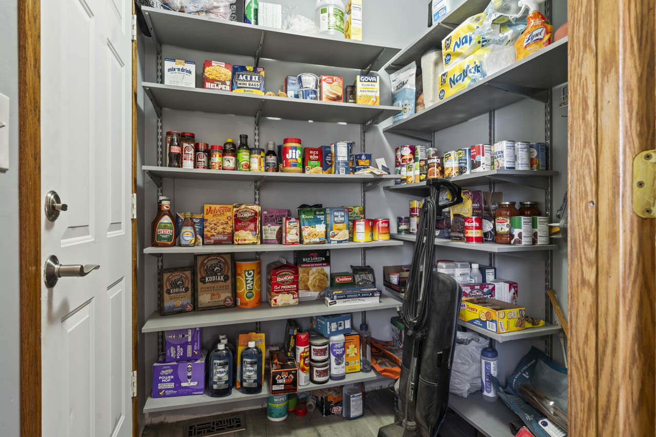 34 Spring Valley Lane Streamwood, IL 60107 - Photo 9 of 24 a room with storage and a shelf