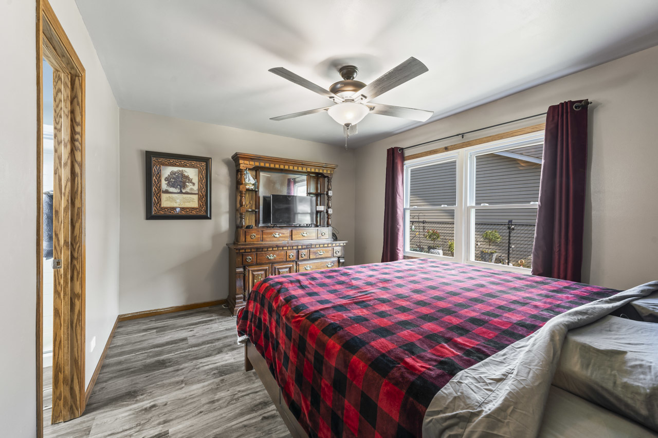 34 Spring Valley Lane Streamwood, IL 60107 - Photo 10 of 24 a bedroom with a large bed and a window