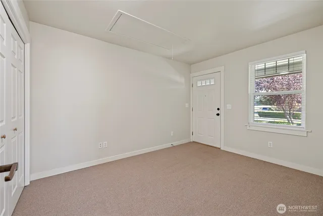 a view of an empty room with a window