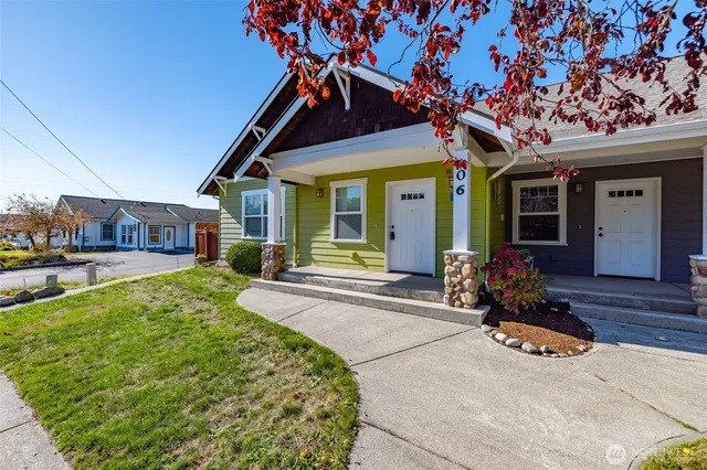 a front view of a house with garden