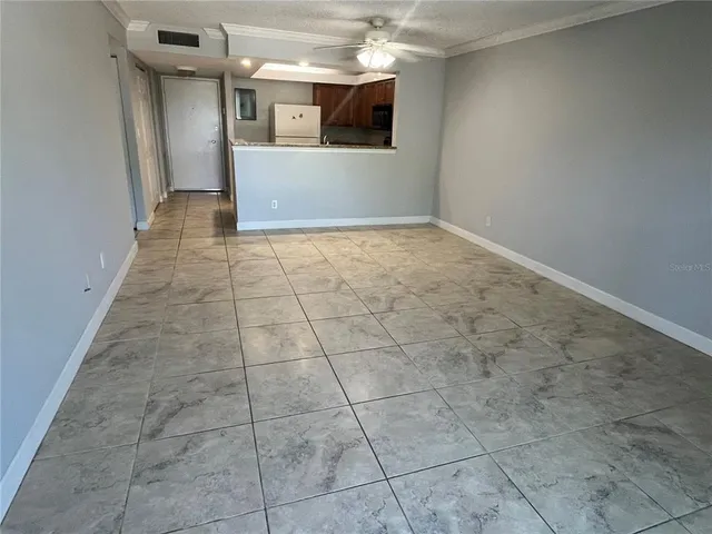 a view of a hallway with a kitchen