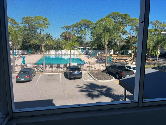 a view of swimming pool from a balcony
