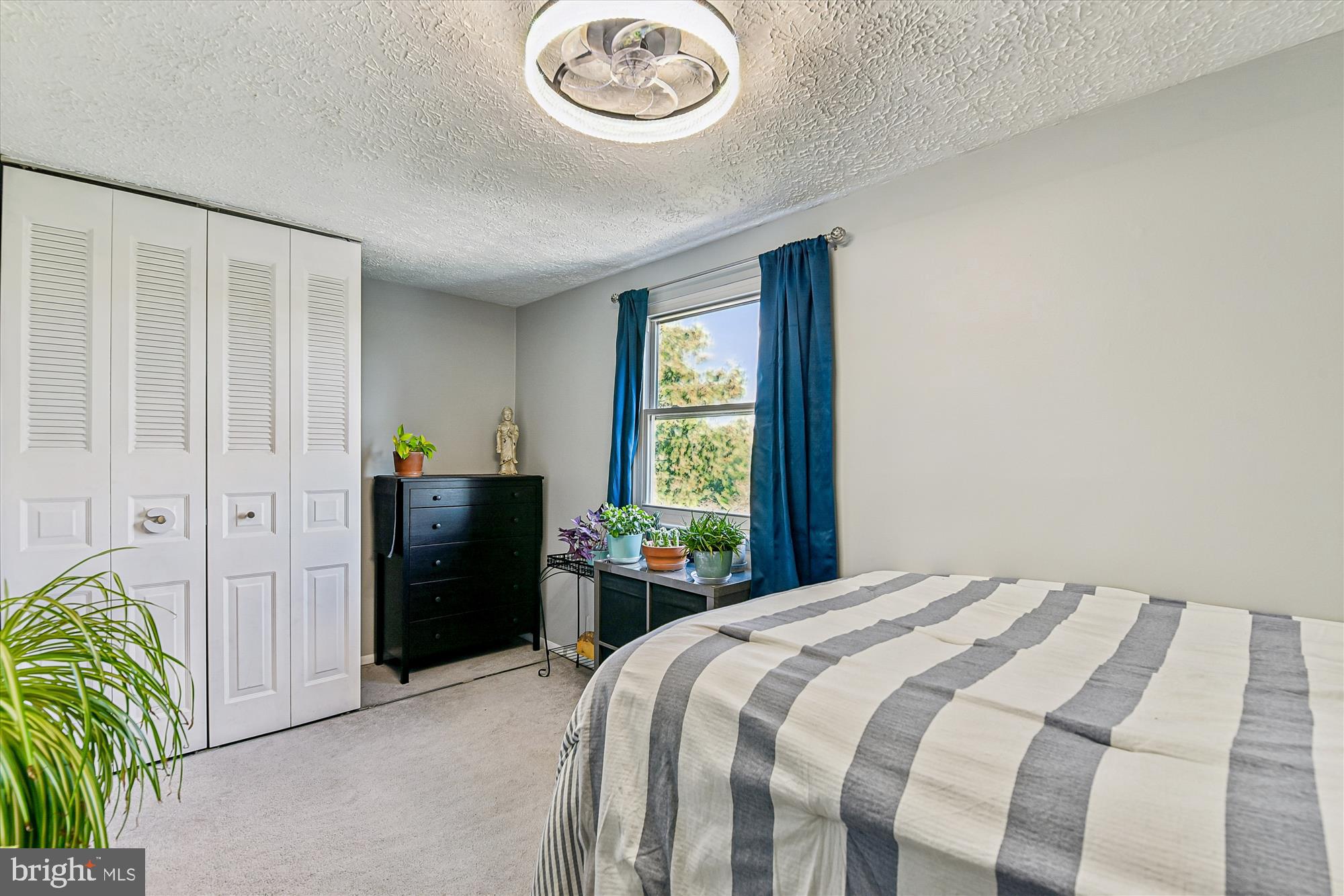 25 Stillwood Circle Nottingham, MD 21236 - Photo 17 of 21 a bedroom with a bed and a chandelier