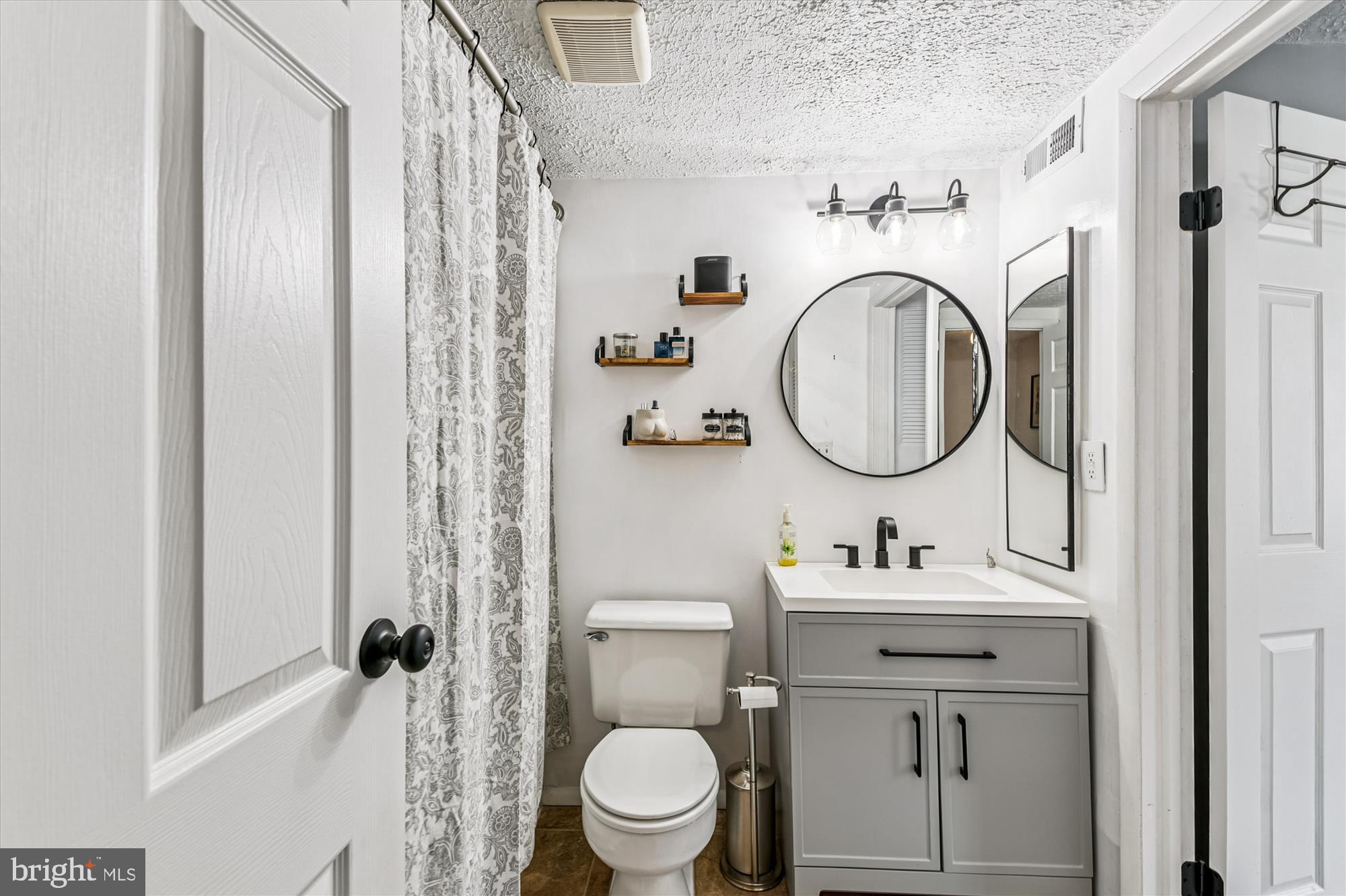 25 Stillwood Circle Nottingham, MD 21236 - Photo 18 of 21 a bathroom with a sink toilet and a mirror