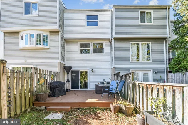 a view of a house with a chairs in patio
