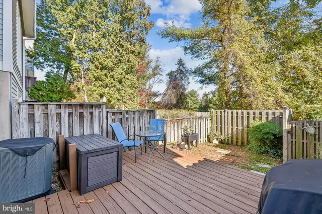 a view of balcony with wooden floor and outdoor seating