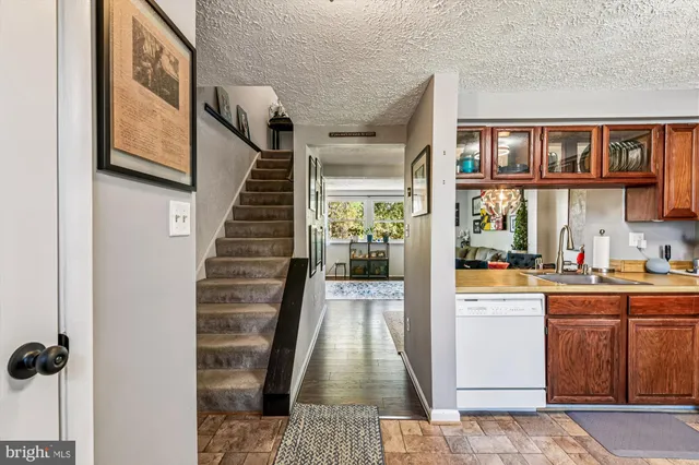 a view of a living room with furniture and a fireplace
