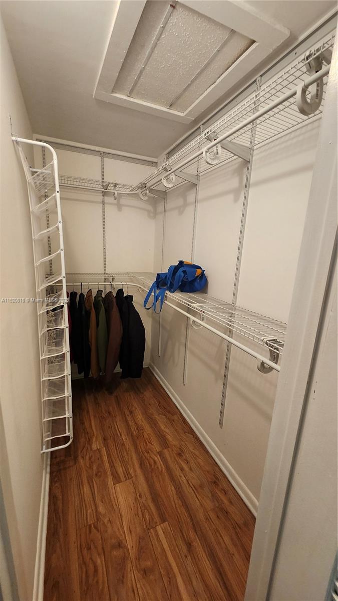 253 Prescott M, Unit 253 Deerfield Beach, FL 33442 - Photo 17 of 53 a view of walk in closet with clothes and shoes