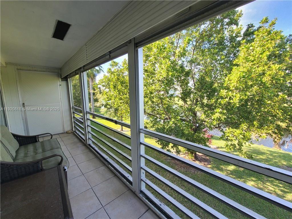 253 Prescott M, Unit 253 Deerfield Beach, FL 33442 - Photo 20 of 53 a view of balcony with furniture