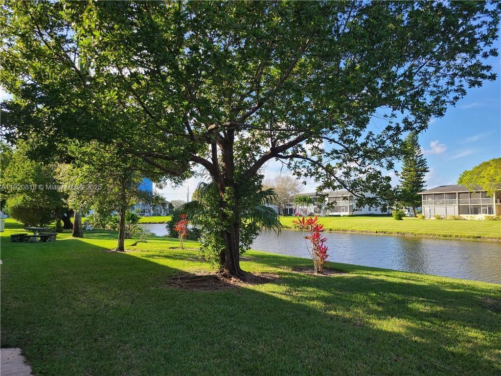 253 Prescott M, Unit 253 Deerfield Beach, FL 33442 - Photo 24 of 53 a view of swimming pool with an outdoor space and seating area