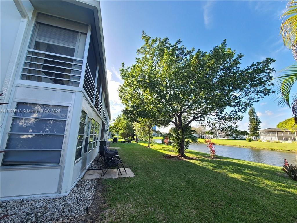 253 Prescott M, Unit 253 Deerfield Beach, FL 33442 - Photo 26 of 53 a view of outdoor space and yard