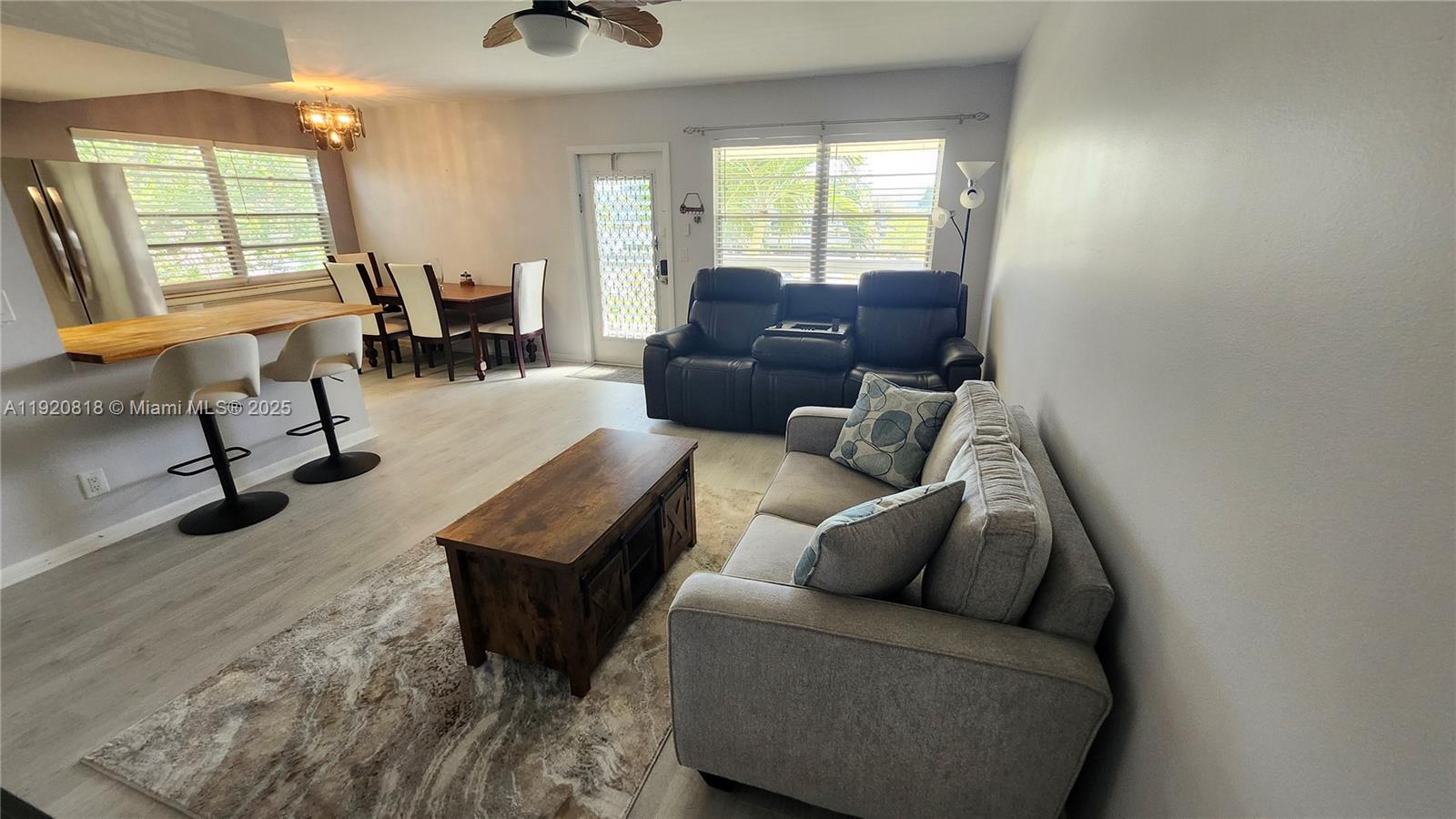 253 Prescott M, Unit 253 Deerfield Beach, FL 33442 - Photo 9 of 53 a living room with furniture and a window