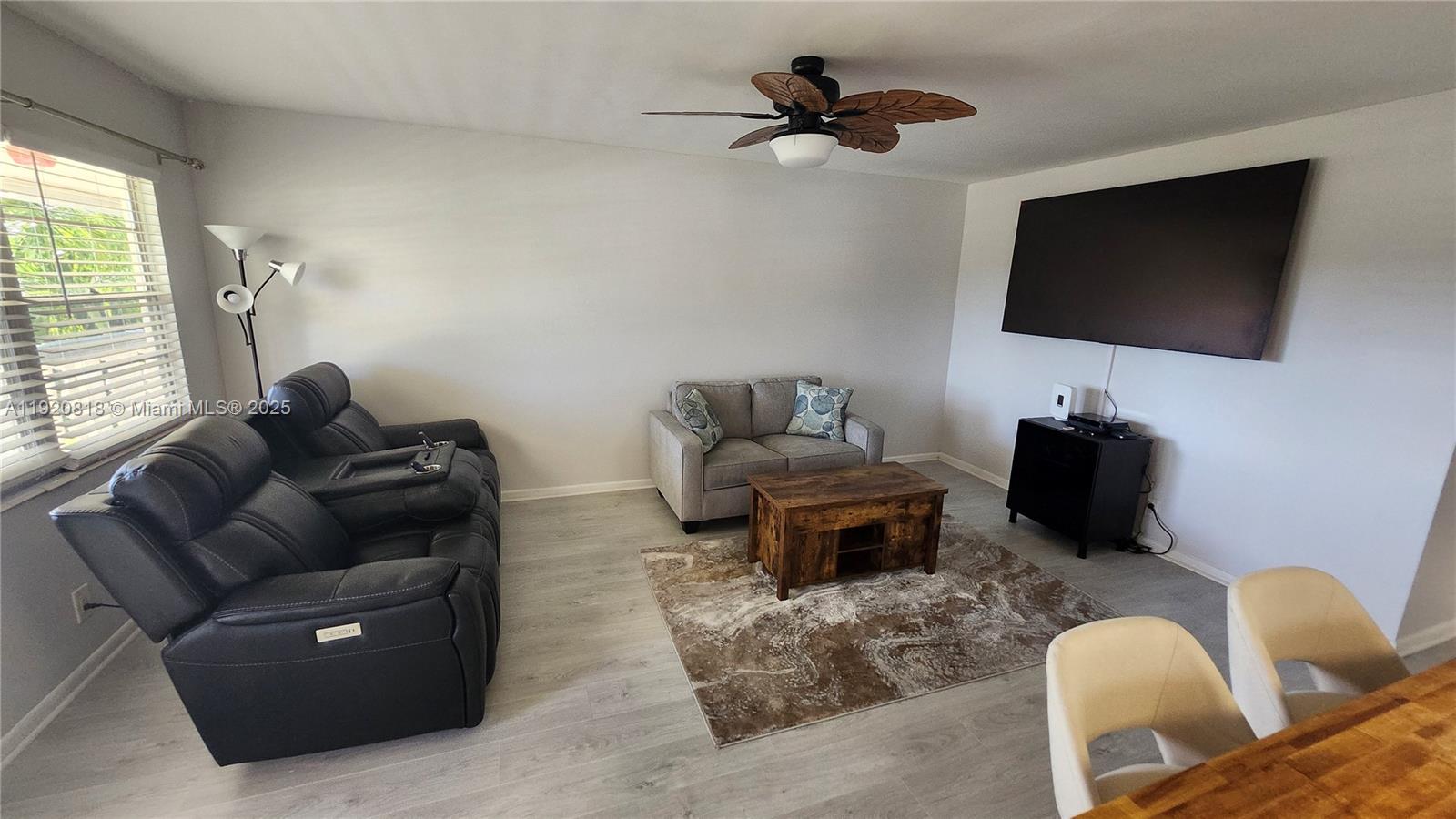 253 Prescott M, Unit 253 Deerfield Beach, FL 33442 - Photo 10 of 53 a living room with furniture and a flat screen tv