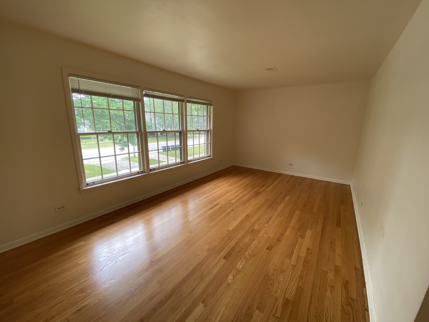 518 Anderson Boulevard, Unit 2S Geneva, IL 60134 - Photo 2 of 8 a view of room with window and wooden floor