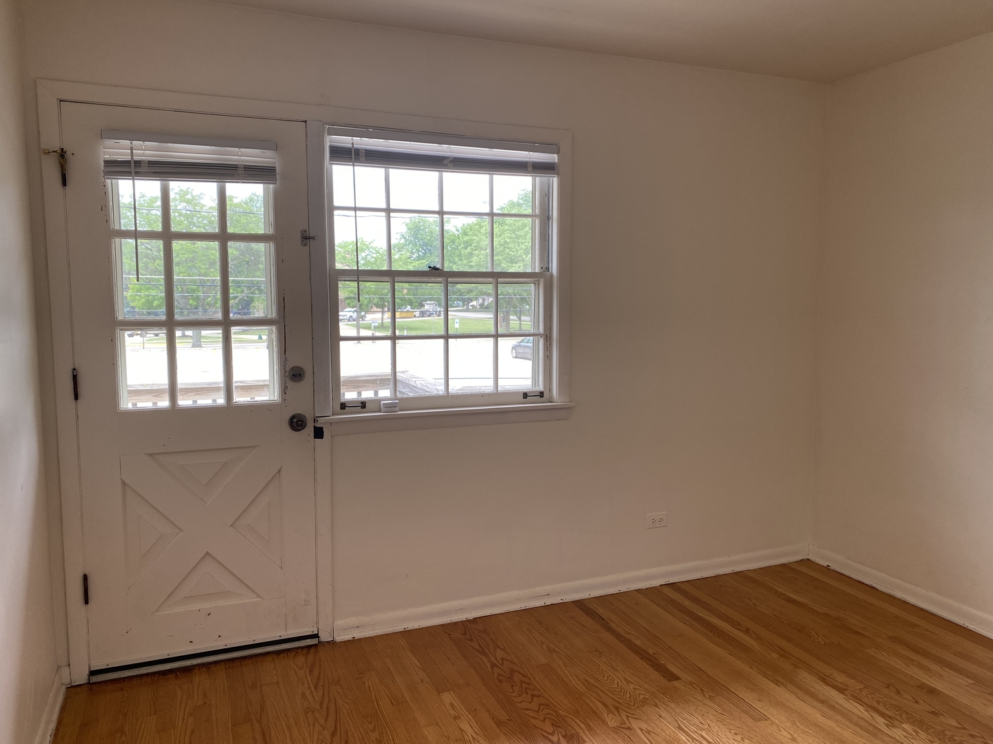 518 Anderson Boulevard, Unit 2S Geneva, IL 60134 - Photo 8 of 8 an empty room with wooden floor and windows