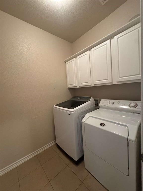 5820 Stone Mountain Road The Colony, TX 75056 - Photo 20 of 27 a utility room with dryer and washer