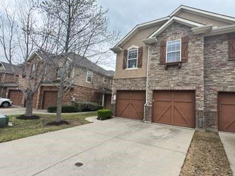 5820 Stone Mountain Road The Colony, TX 75056 - Photo 2 of 27 a front view of a house with yard and trees