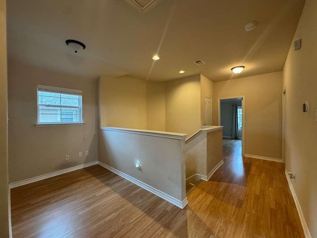 5820 Stone Mountain Road The Colony, TX 75056 - Photo 7 of 27 a view of empty room with wooden floor