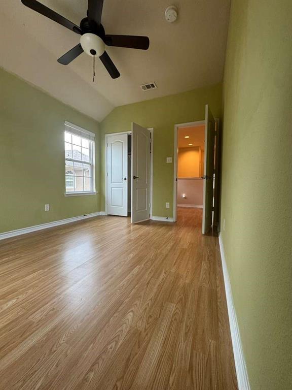 5820 Stone Mountain Road The Colony, TX 75056 - Photo 9 of 27 wooden floor in an empty room with a window