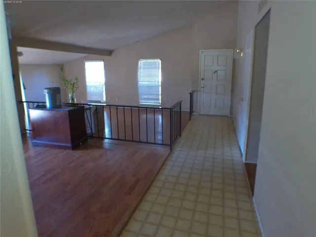 a view of hallway with windows