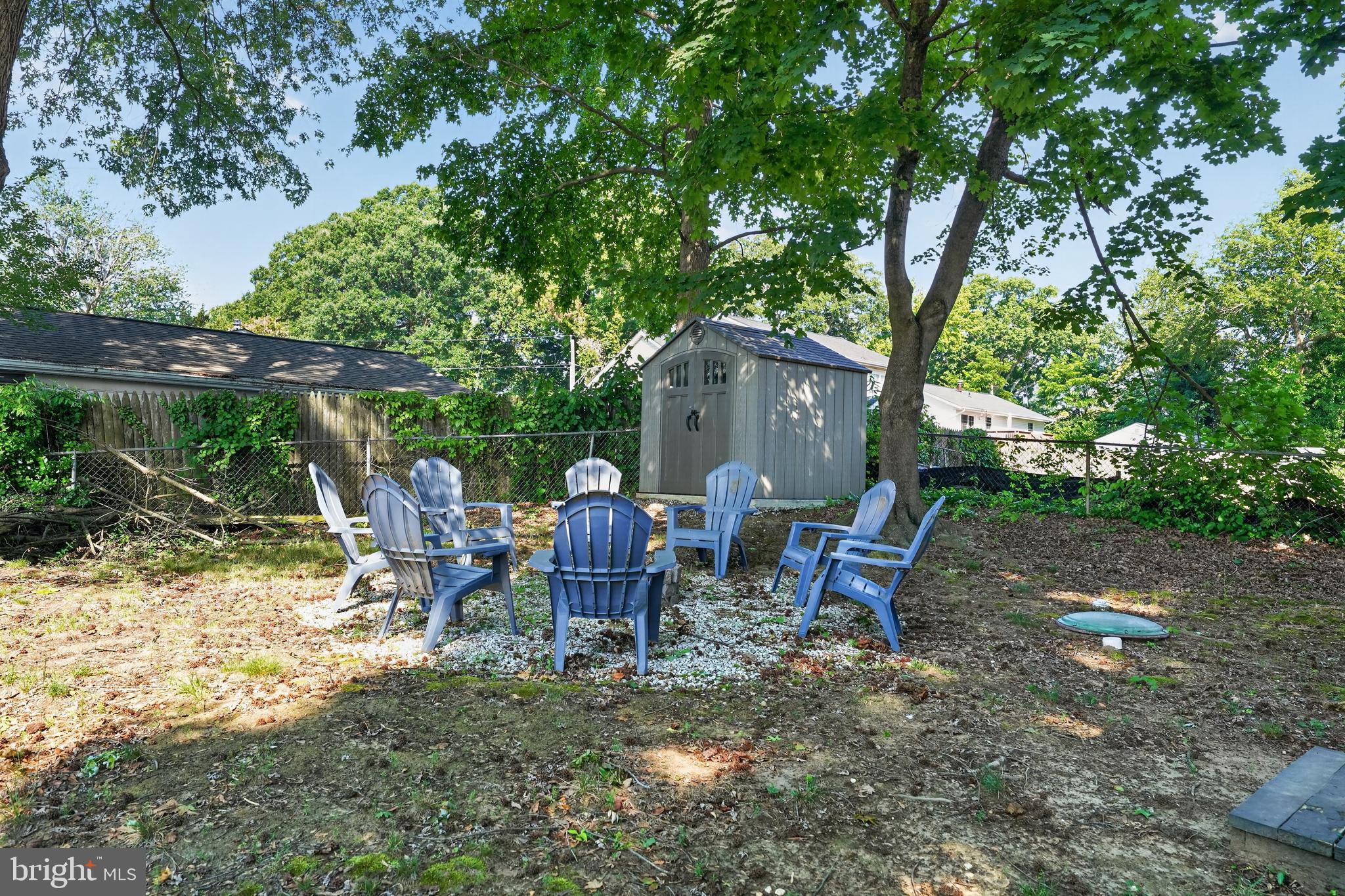 3670 5th Avenue Edgewater, MD 21037 - Photo 21 of 60 a backyard of a house with table and chairs