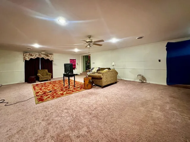 a living room with furniture and a rug
