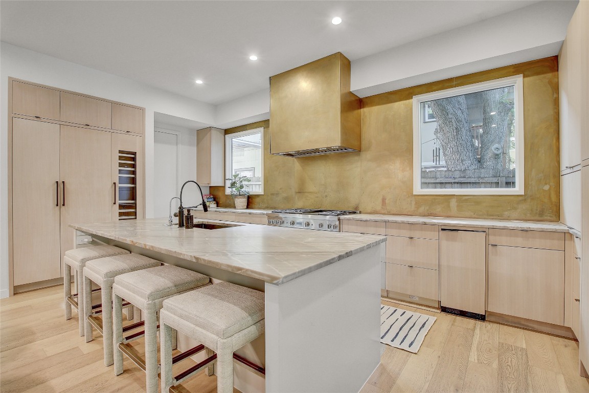 2006 Ford Street Austin, TX 78704 - Photo 11 of 40 Kitchen featuring quartz counter tops and metallic gold back splash