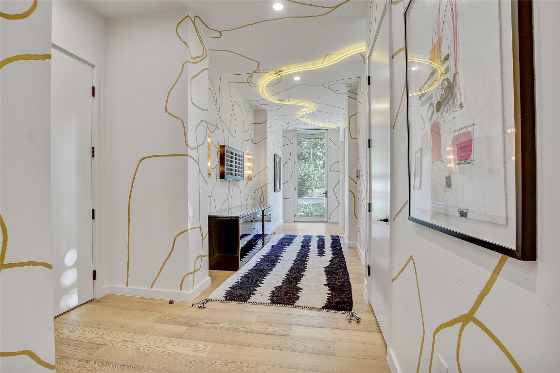 2006 Ford Street Austin, TX 78704 - Photo 22 of 40 Hall with wood finished floors and curated lighting fixtures