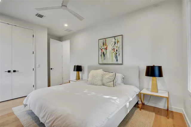 a view of a patio with table and chairs potted plants and large tree