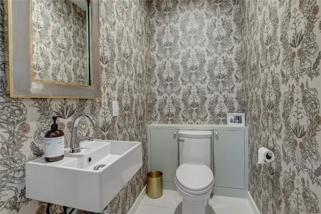 a bedroom with furniture and a flat screen tv