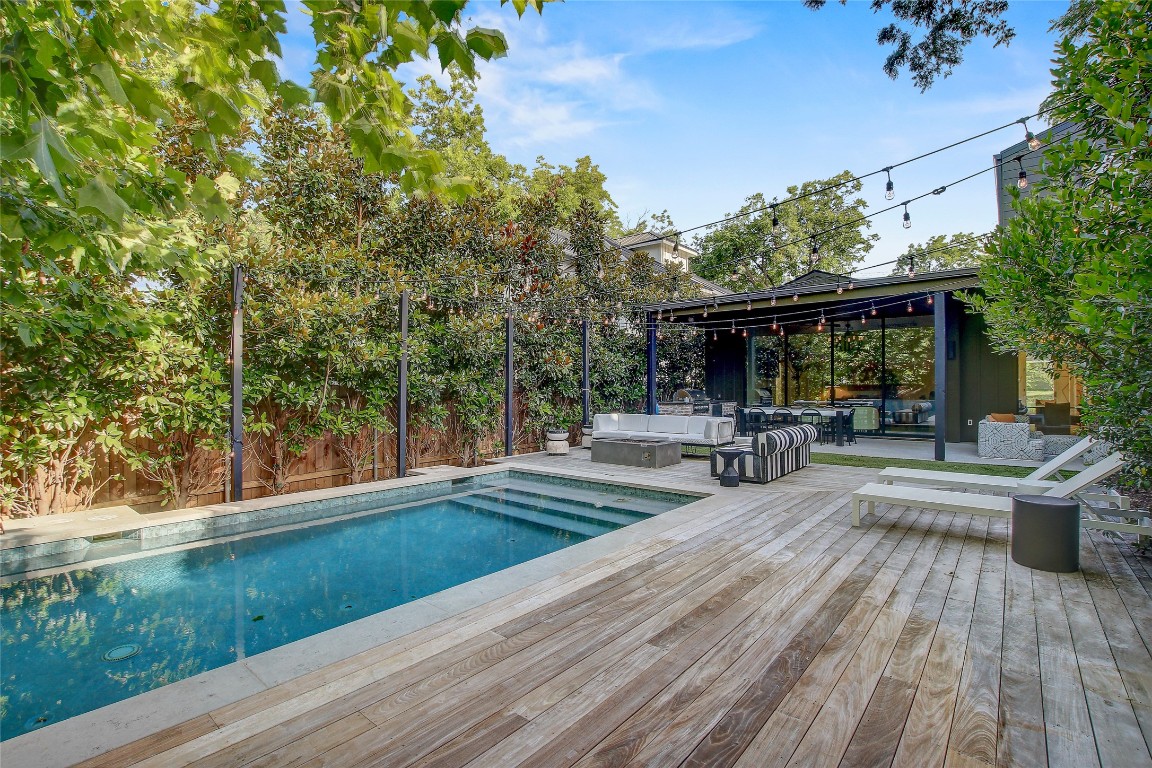 2006 Ford Street Austin, TX 78704 - Photo 37 of 40 Swimming pool with an outdoor living space, a wooden deck, and a patio area
