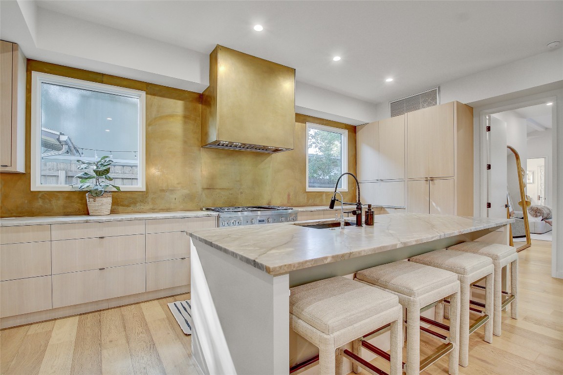 2006 Ford Street Austin, TX 78704 - Photo 10 of 40 Kitchen featuring quartz counter tops and metallic gold back splash