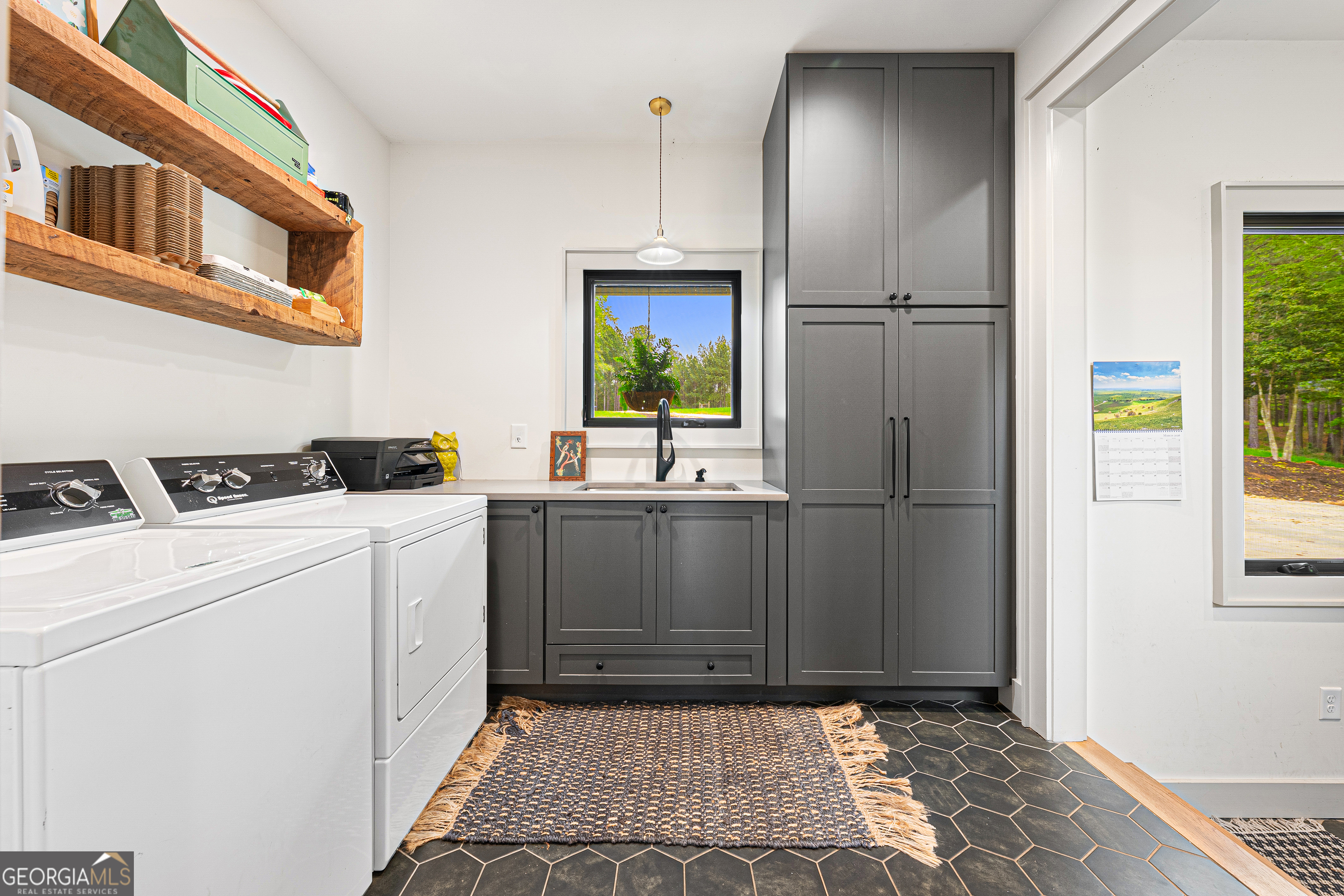 630 Human Road Bowman, GA 30624 - Photo 22 of 36 a kitchen with a refrigerator and a sink