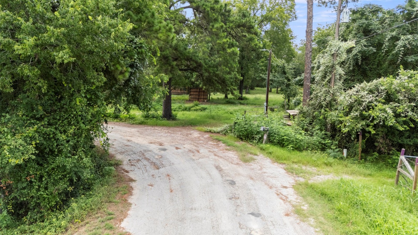 140 Rice Avenue Bastrop, TX 78602 - Photo 4 of 33 a view of a road with a yard