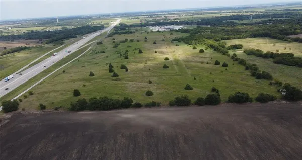 a view of a lake with a yard