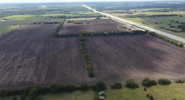 an aerial view of beach and yard