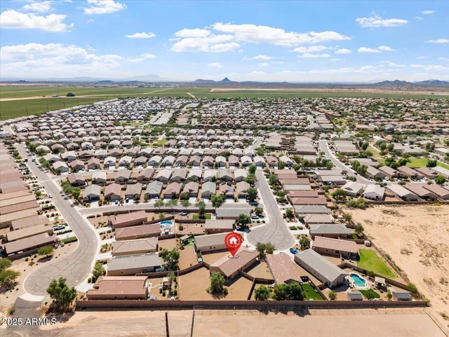 an aerial view of residential building and ocean