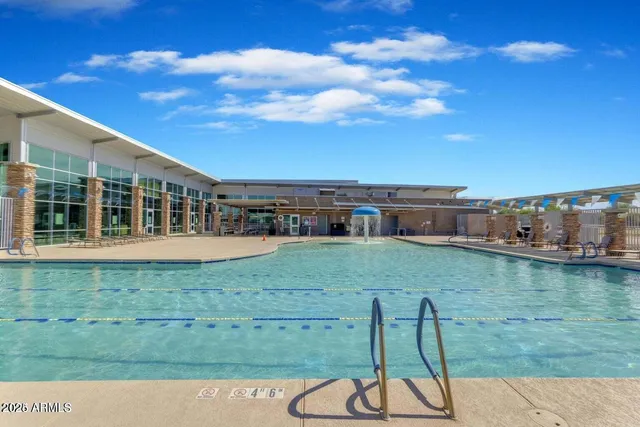 a view of a swimming pool with a yard