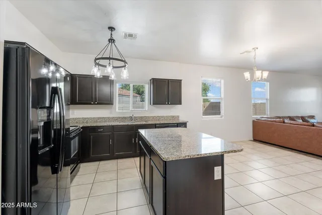 an empty room with wooden floor and mirror