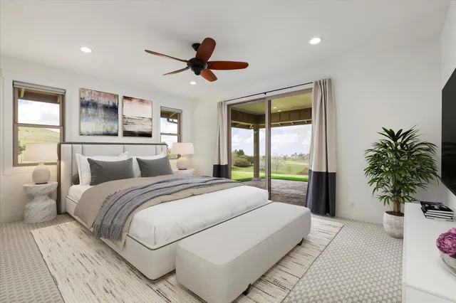 a spacious bedroom with a large bed and a large window