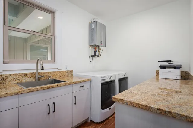 a kitchen with a sink and cabinets