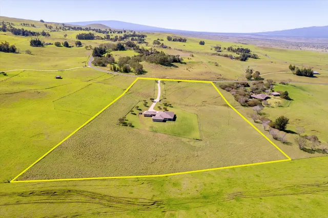 a view of a table and chairs in front of a house