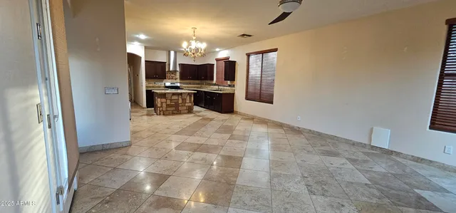 a kitchen with granite countertop a refrigerator and a sink
