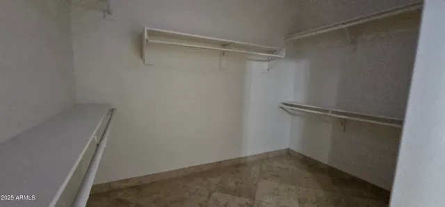 a view of a room with shelf on the wall